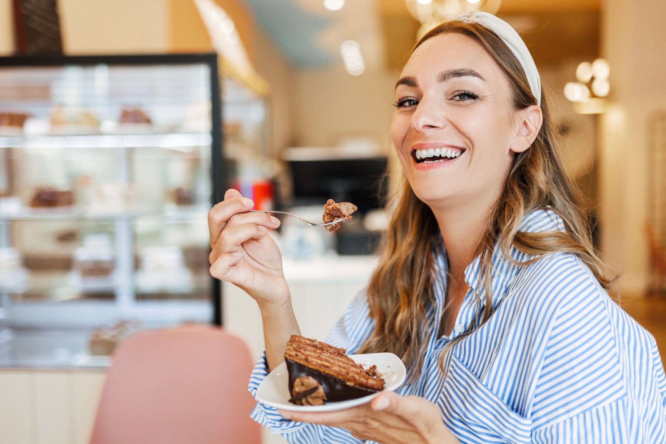 Happy woman with pastry plate